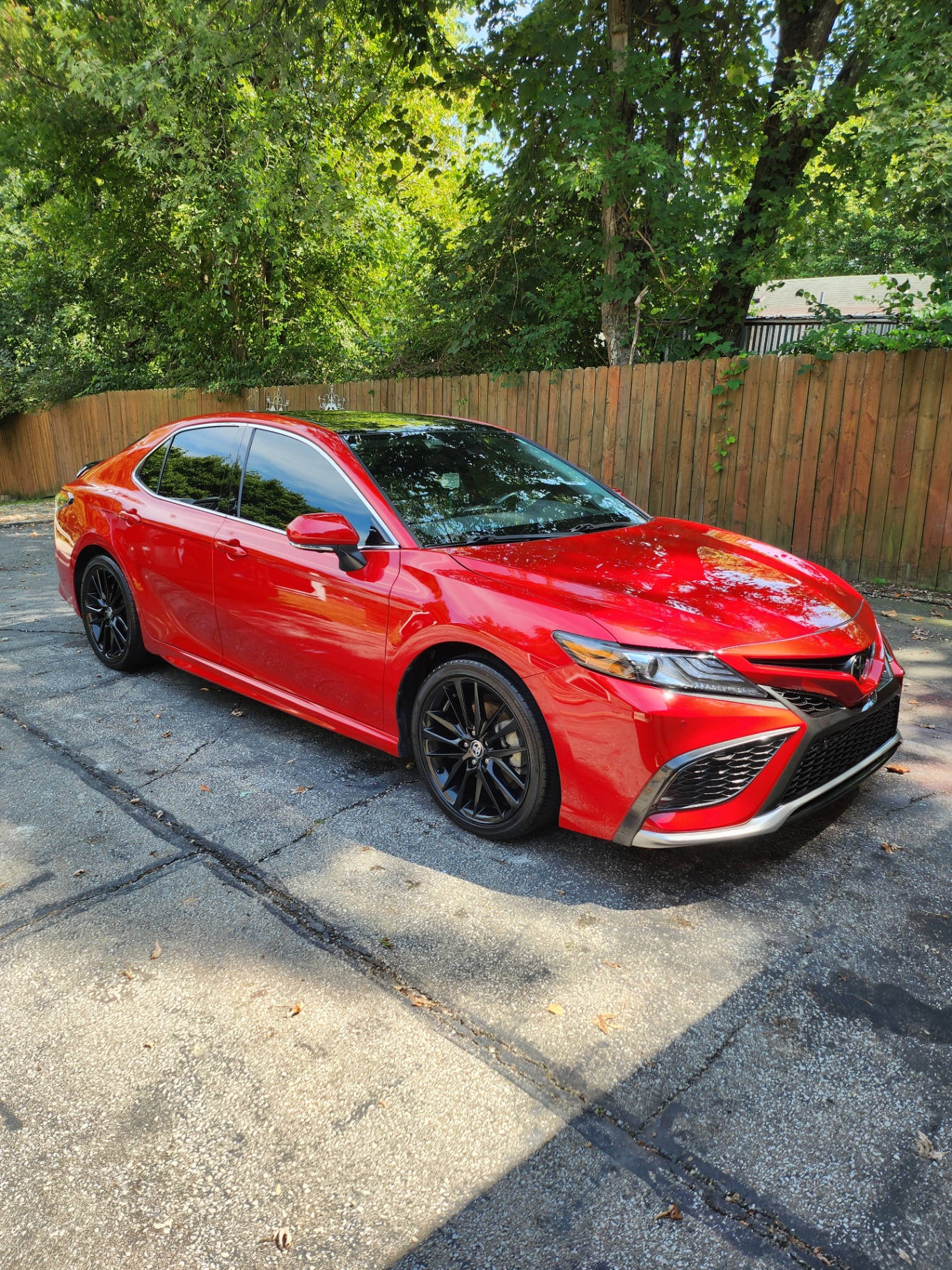 Red Toyota Camry paint enhancement with deep gloss finish